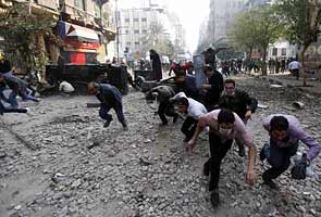 As crowds swell in Cairo, military in crisis talks