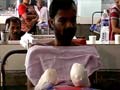 Tried to save woman, was pushed off train, arms amputated
