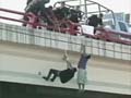 Teen survives being shot, dangled from bridge