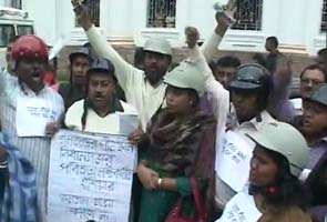 Congress' way of dealing with clashes in Bengal Assembly: Lawmakers wear helmets Congress' way of dealing with clashes in Bengal Assembly: Lawmakers wear helmets