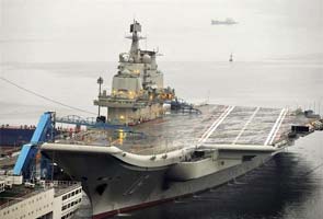 China to build second, larger carrier for fighter jets: report