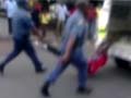 South Africa suspends eight policemen who dragged man behind vehicle