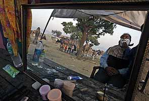 File pic: A man gets during the annual cattle fair in Pushkar, Rajasthan