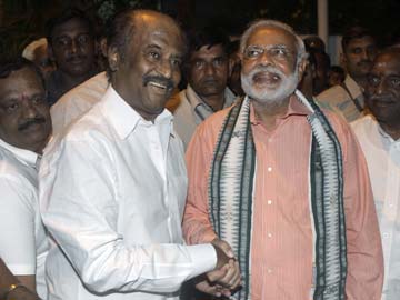Wish Modi well, says Rajinikanth with a hug Wish Modi well, says Rajinikanth with a hug