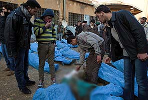 At least 65 bodies found in Syrian mass killing, activists say
