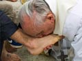 Pope Francis washes women's feet in break with church law