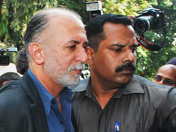 Tarun_Tejpal_escorted_outside_court_AFP_360x270.jpg