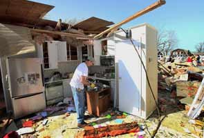 TORNADOS: Violent storms kill more than 30 in four states