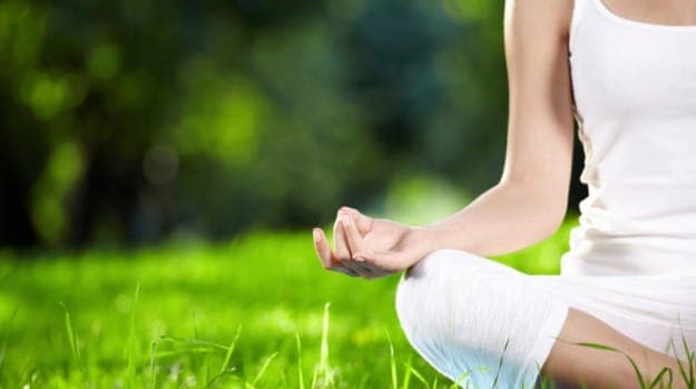Yoga reduces stress levels and promotes relaxation, which can help manage PCOS