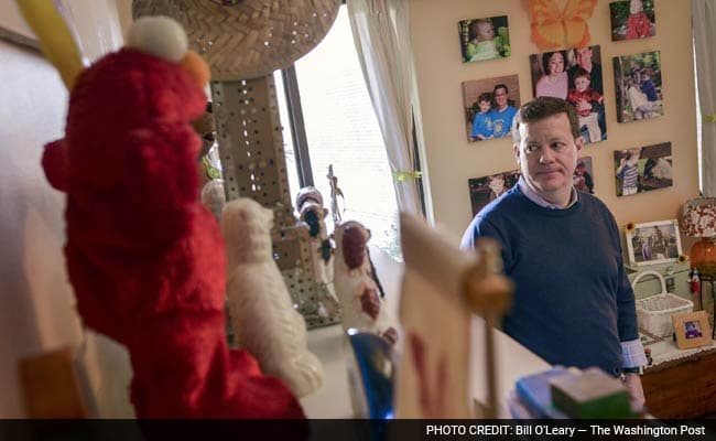 Peter Brown stands in the bedroom of his late son, Mattie. Brown and wife Vicki run their foundation, Mattie Miracle, in Washington, DC. (Photo by: Bill O'Leary - The Washington Post)