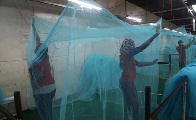 Workers look for holes in mosquito netting at the A to Z Textile Mills factory producing insecticide-treated bednets in Arusha, Tanzania. (Reuters Photo)