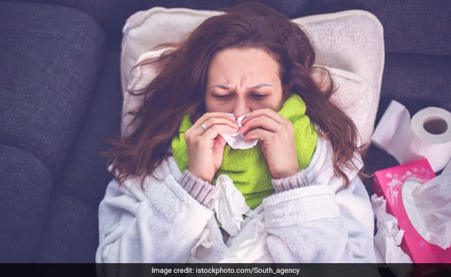 Periods can cause flu-like symptoms including headache, nausea, and even fever
