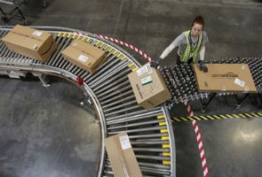 Amazon.com's profit tumbles more than expected