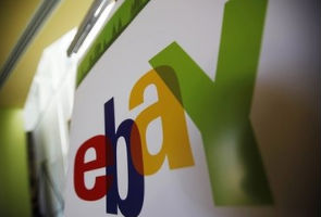 EBay profit falls on charges, results beat Street