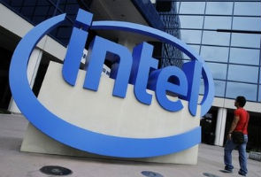 Business buying lifts Intel as tablet threat looms