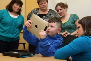 iPads take a place next to crayons in kindergarten