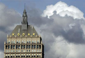 Kodak realigns business structure; sues Apple, HTC