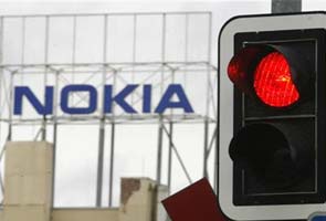 Fitch cuts Nokia to junk, outlook negative