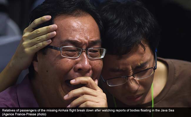 AirAsia_relatives_cry_AFP_650_caption.jpg
