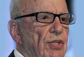 Murdoch staff arrested for bribery, office searched