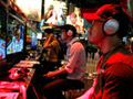 Japanese playing a new video game: Catch-Up