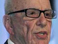 Murdoch staff arrested for bribery, office searched